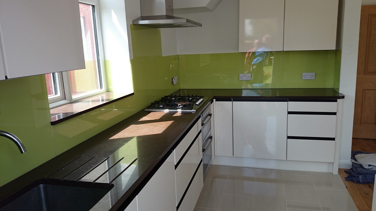 Lime green glass kitchen splashback installed by Banstead glaziers