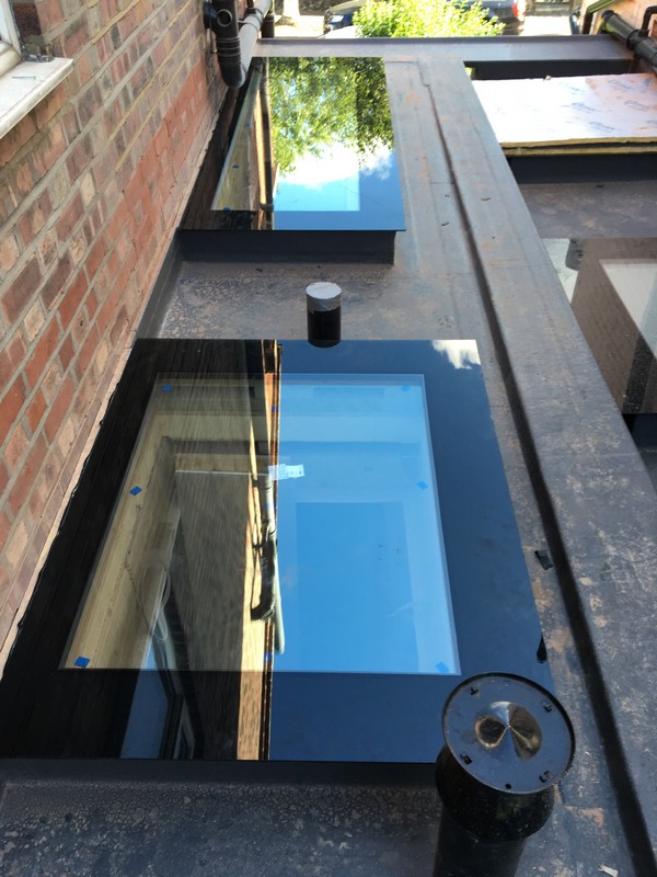 Multiple flat roof skylights on extension in Banstead